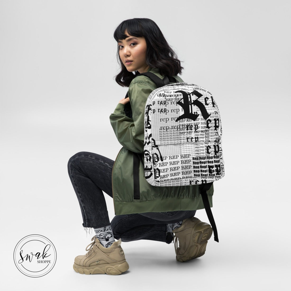 Rep Newsprint Type Backpack With Pocket