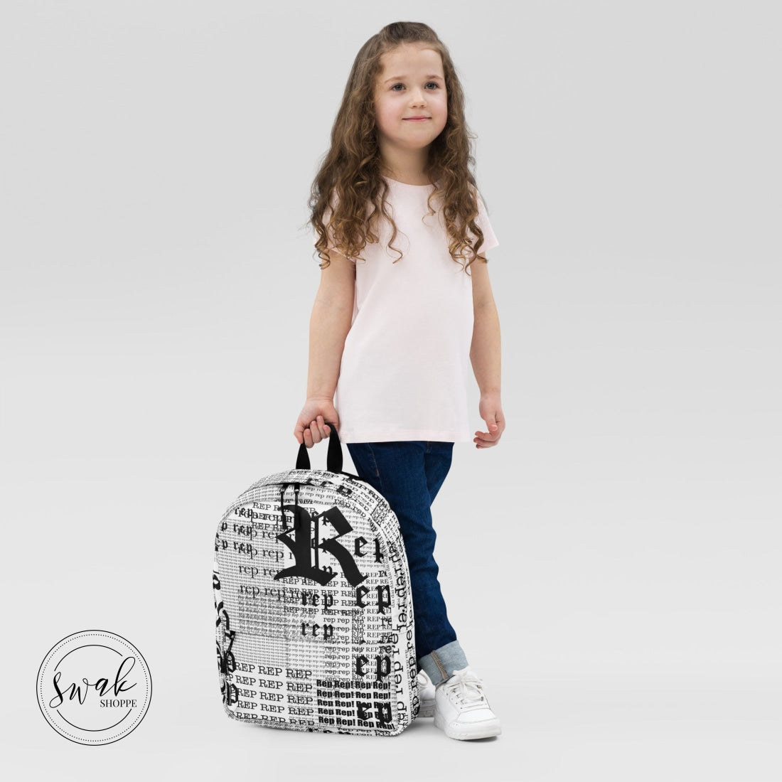 Rep Newsprint Type Backpack With Pocket